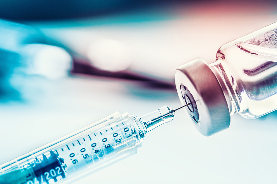 A needle filling up with medicine