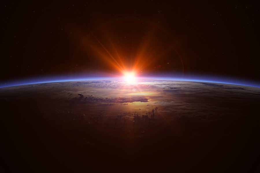 The sun rising over earth