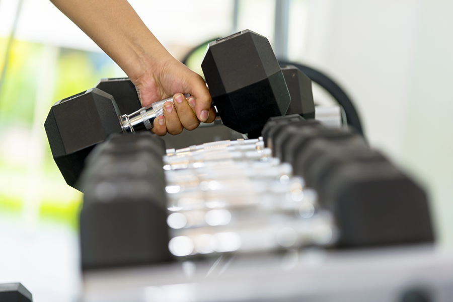 A human hand lifting a weight